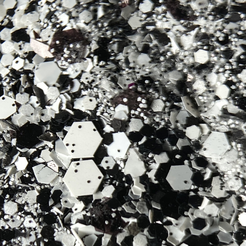 NAGAIA Shadow Fiend dip powder — black chunky glitter nail color swatch
