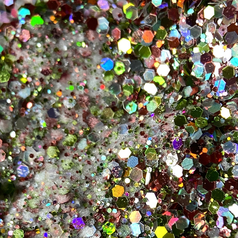 NAGAIA Rainbow Revelry dip powder — gold mixed glitter nail color swatch