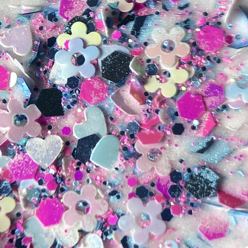NAGAIA Pop Art Flor dip powder — purple shaped glitter nail color swatch